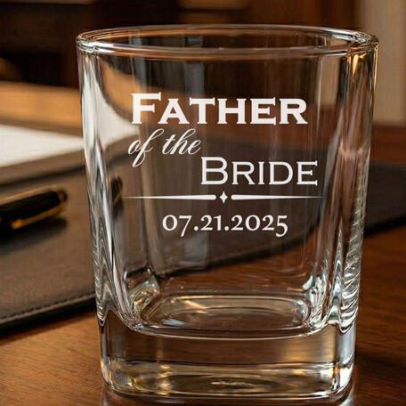 Custom laser-engraved 9oz whiskey glass for a wedding gift, featuring 'Father of the Bride' and the wedding date. High-contrast frosted engraving on a square-bottomed rocks glass, perfect for wedding party favors and bridal party gifts.