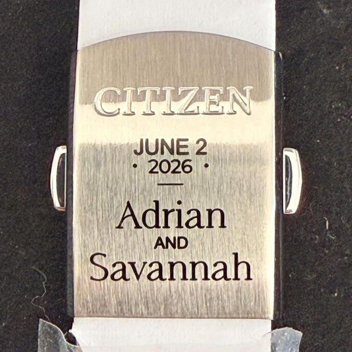 Custom engraved wedding watch clasp for groom gift. Personalized stainless steel jewelry engraving featuring names and wedding date. Professional metal marking services in Citrus County, FL.